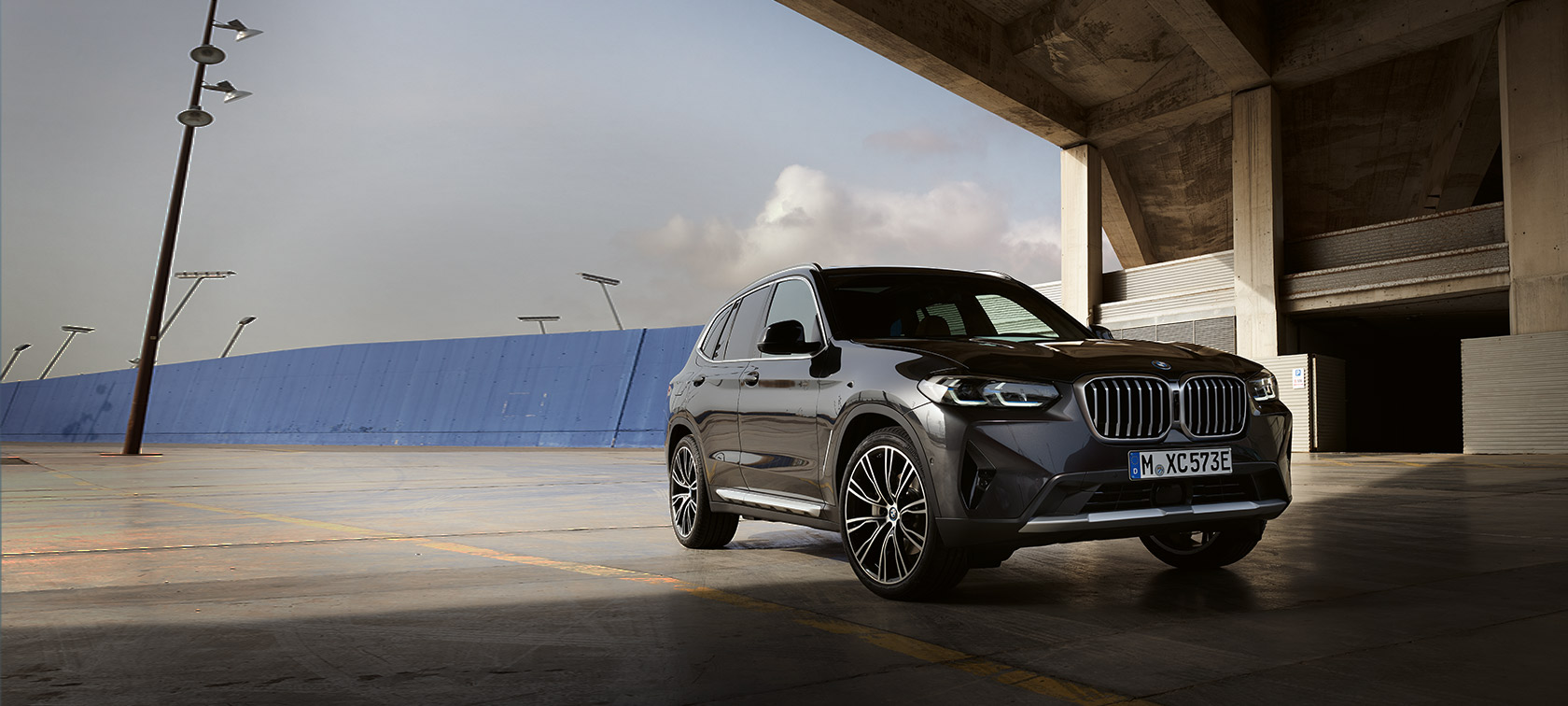 BMW X3 G01 Sophisto Grey three-quarter front view in front of hangar 2021